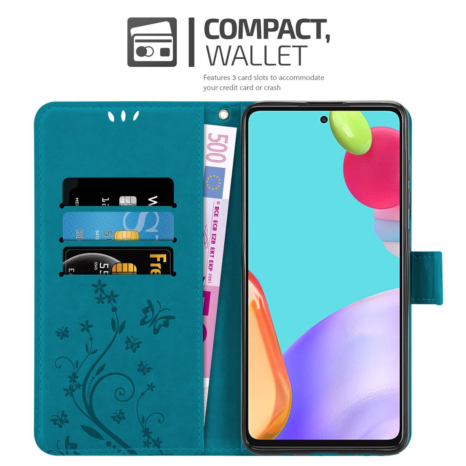 Türkisfarbene Telefonbrieftasche mit Karten und einem 500-Euro-Schein. Ein Telefon ist innen. Die Hülle hat Blumendesigns.