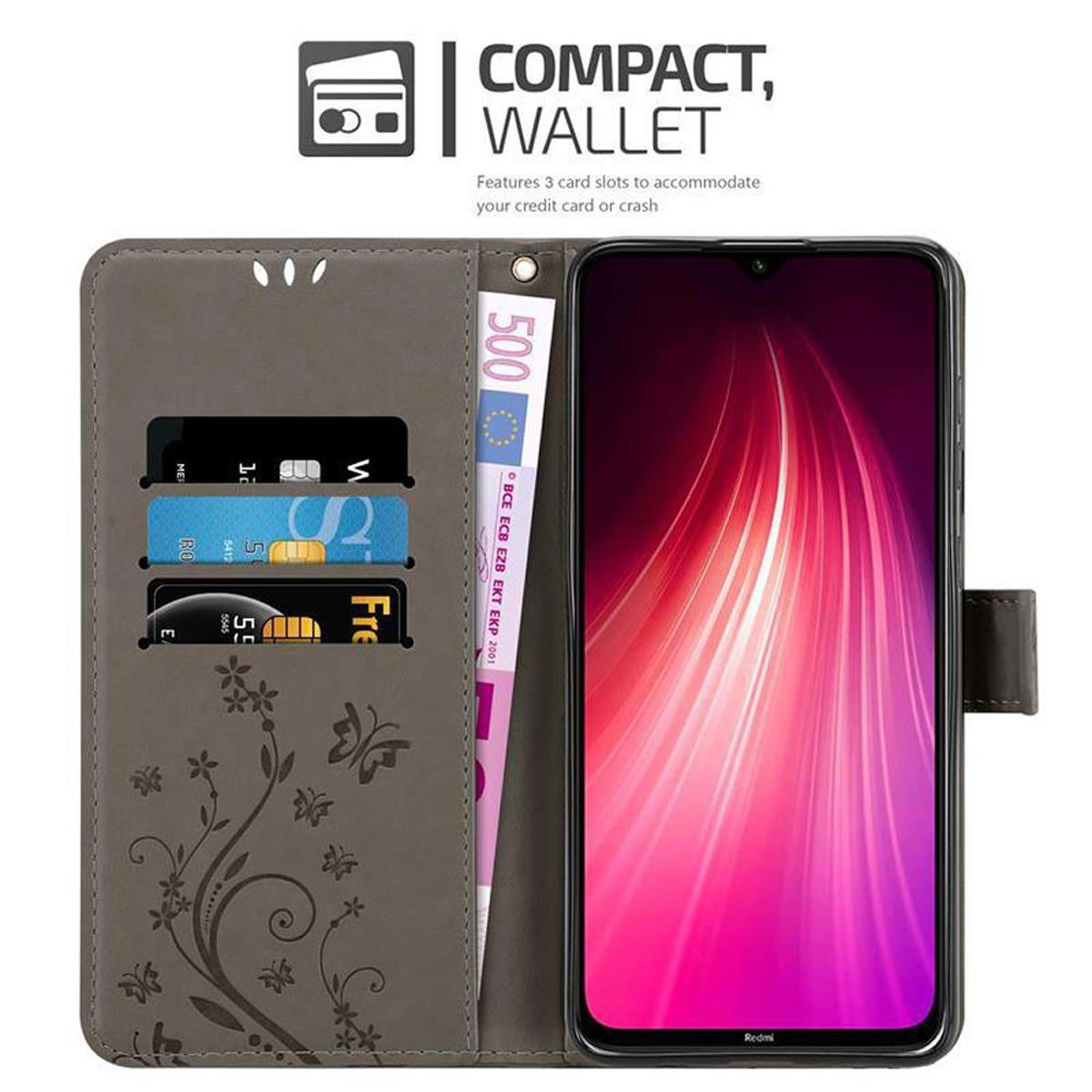 Custodia con carte e denaro. Un telefono all'interno. Portafoglio compatto.
