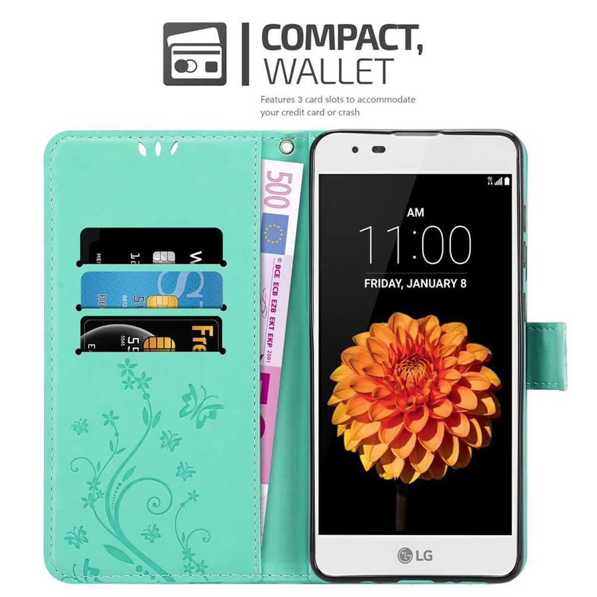 Funda de cartera verde azulado con teléfono y dinero. La cartera tiene ranuras para tarjetas. El teléfono muestra una flor.