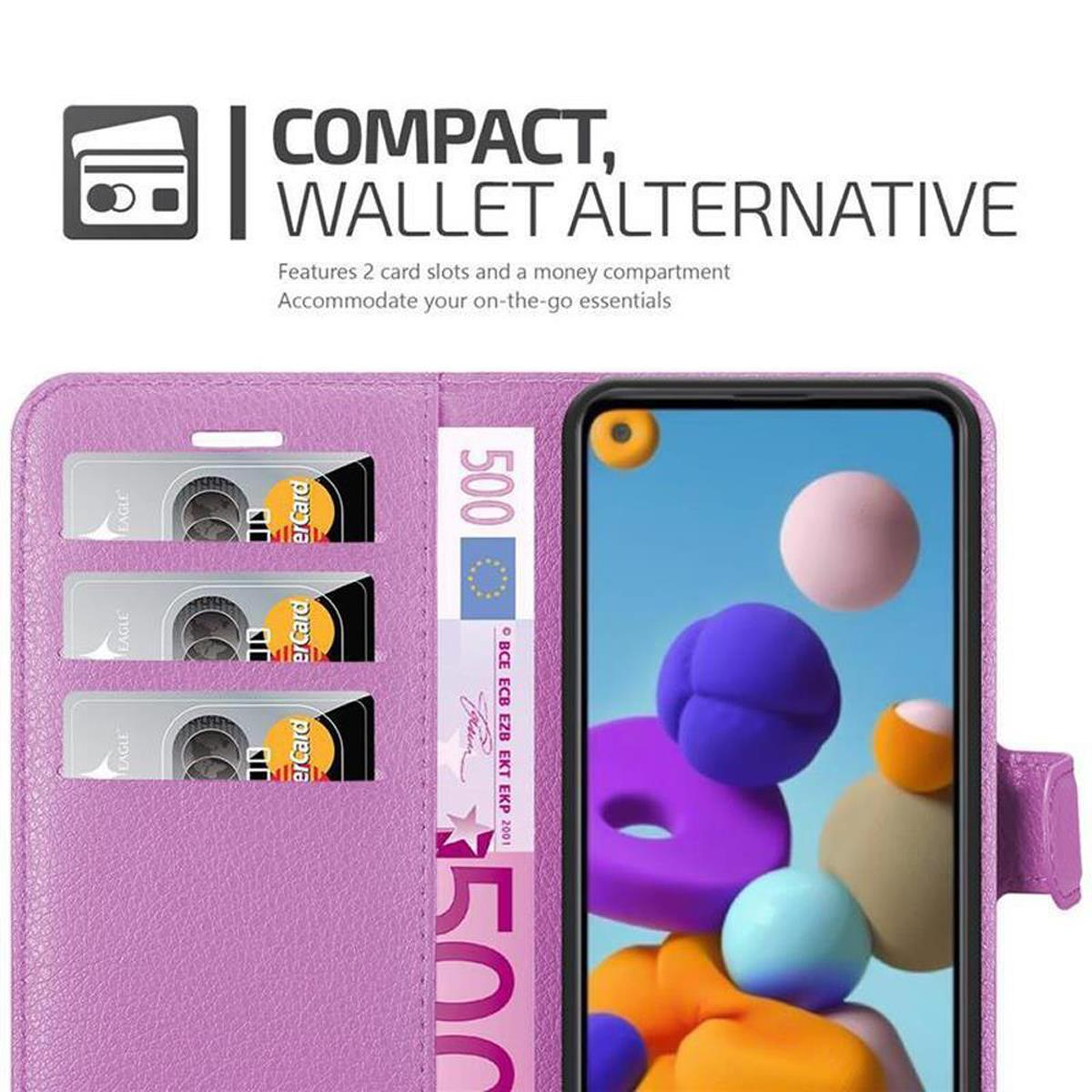 Custodia per telefono viola con carte e banconota da 500 euro. Il telefono mostra arte astratta colorata.