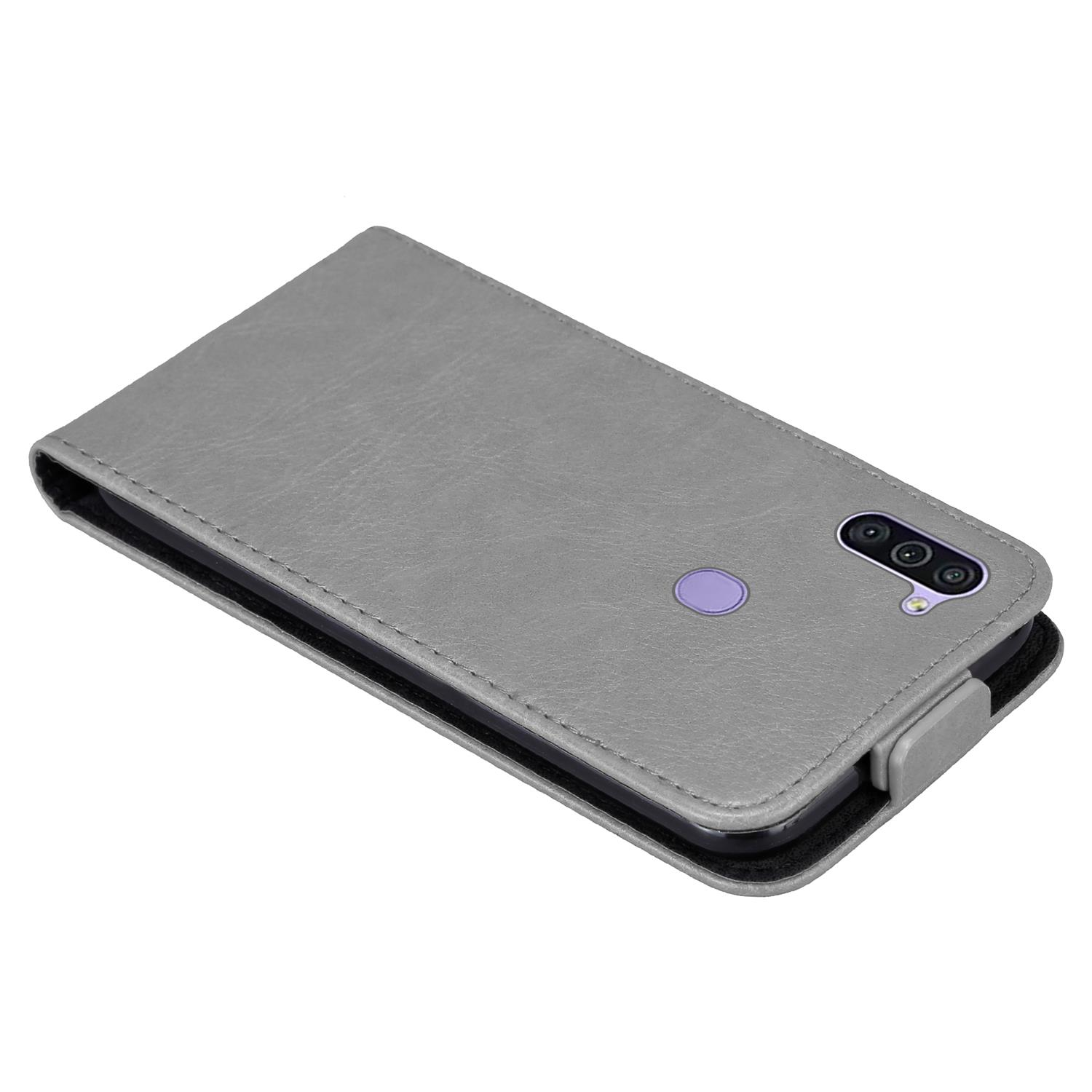 Graue Handyhülle, geschlossen. Ein Telefon mit lila Kamera ist darin.