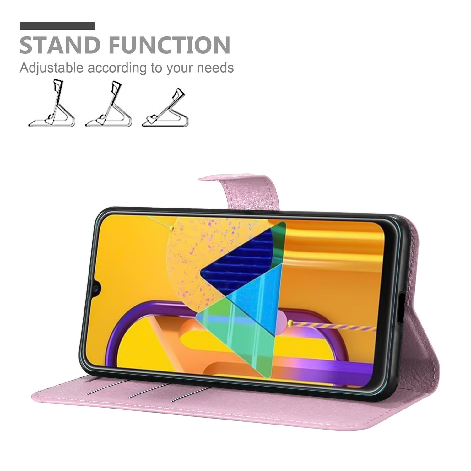 Custodia a portafoglio rosa aperta con telefono. Il telefono mostra la schermata iniziale. Testo: STAND FUNCTION.