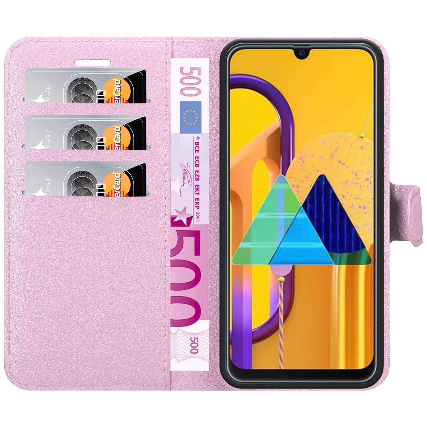 Custodia a portafoglio rosa aperta, con carte e denaro all'interno. Schermo del telefono visibile.