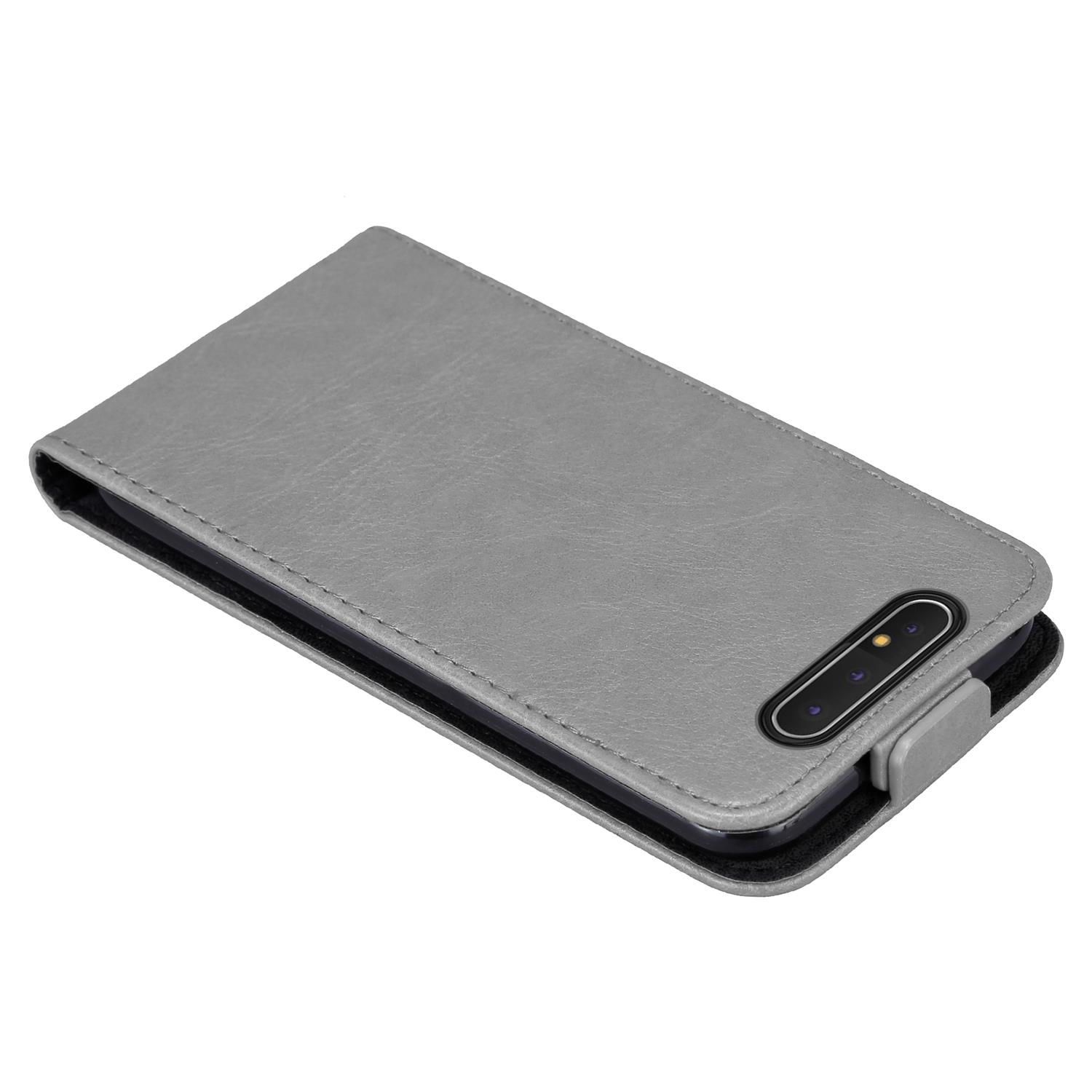 Graue Handyhülle mit einem Telefon darin.