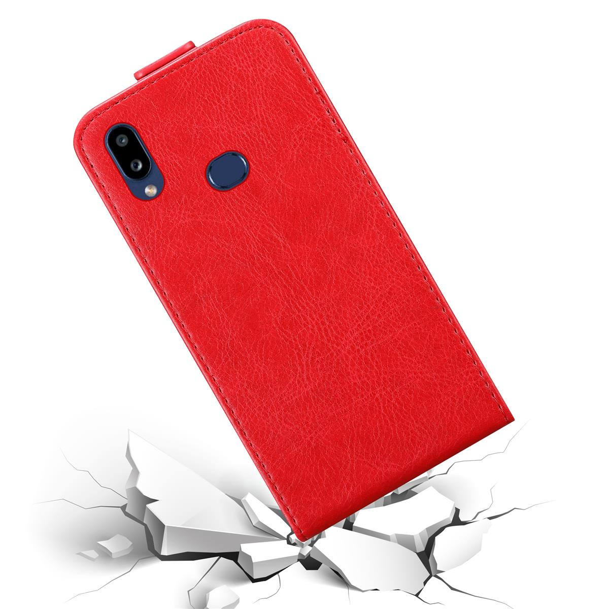 Custodia per telefono rossa che cade su un terreno fratturato. La custodia è di colore uniforme e ha un ritaglio per la fotocamera.