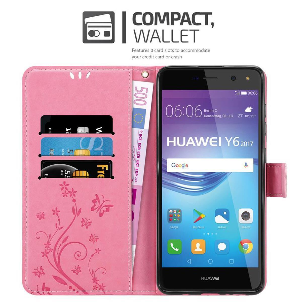 Custodia rosa per telefono con telefono all'interno. Con scomparti per carte e design a farfalla.