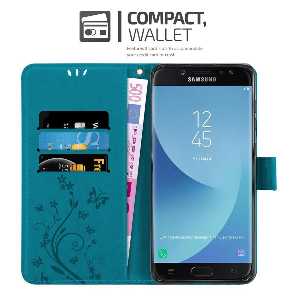 Una custodia a portafoglio verde acqua, aperta, che mostra un telefono, scomparti per carte e una banconota. Il logo Samsung è visibile.