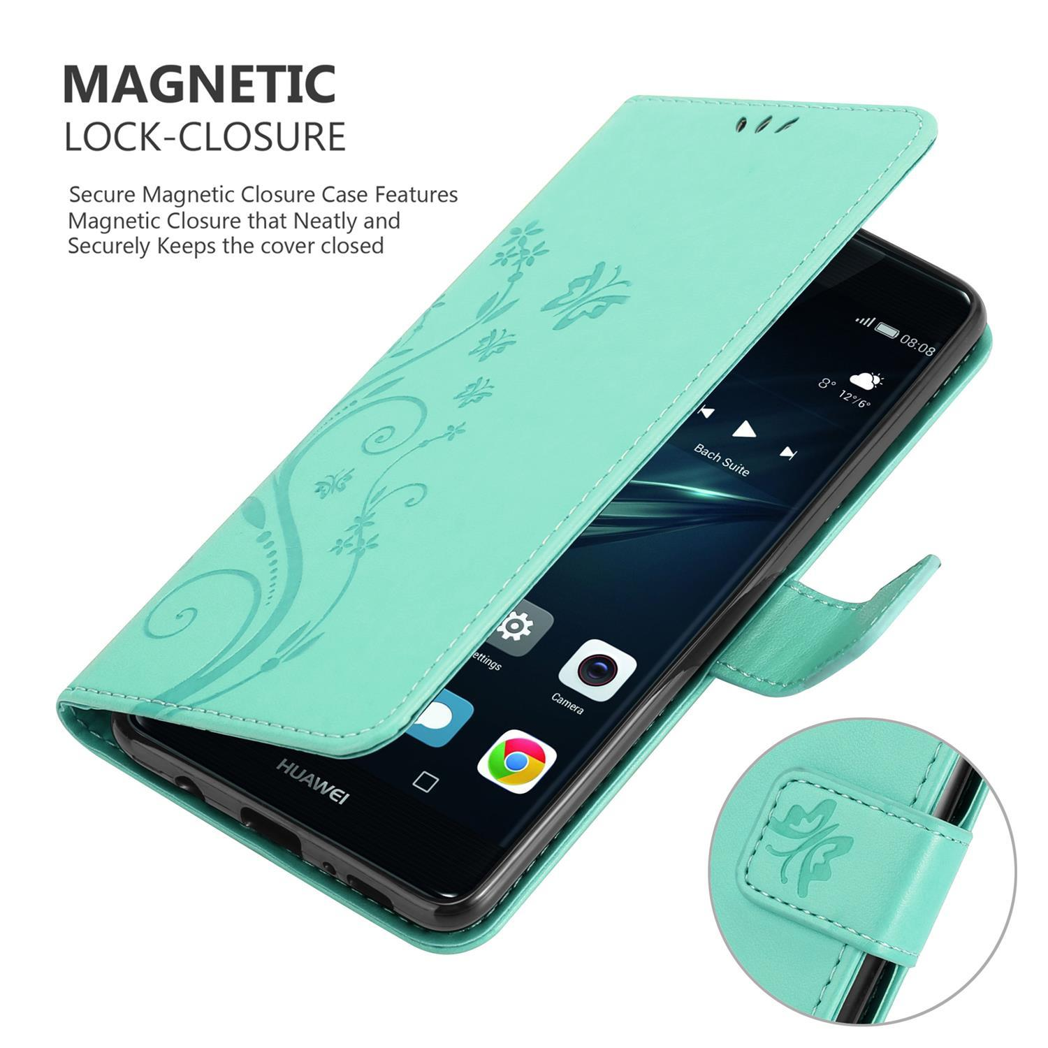 Minzgrüne Handyhülle offen mit einem Telefon im Inneren. Hülle hat Blumenmuster. Text: 'Magnetischer Verschluss'.