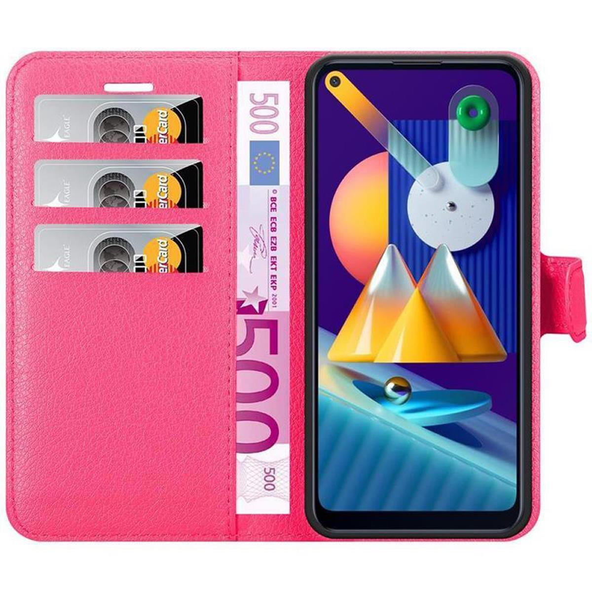 Custodia per telefono rosa, aperta, con telefono, denaro e carte all'interno. Schermo del telefono con display colorato.