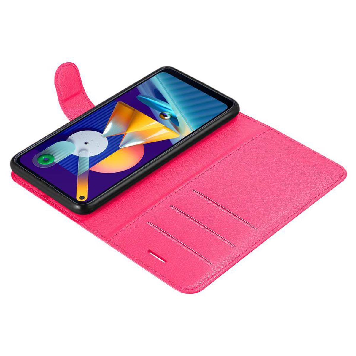 Una custodia rosa per telefono, aperta, con un telefono nero all'interno. Il telefono ha una cornice nera e interni rosa.