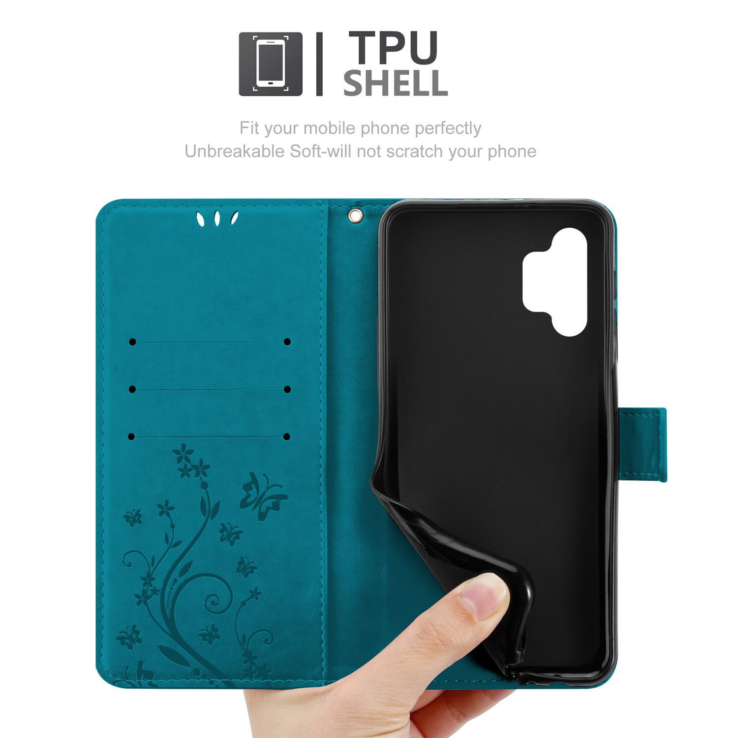 Custodia turchese aperta con telefono. Mano che tiene la custodia. Testo: Guscio TPU, adatta il tuo telefono.