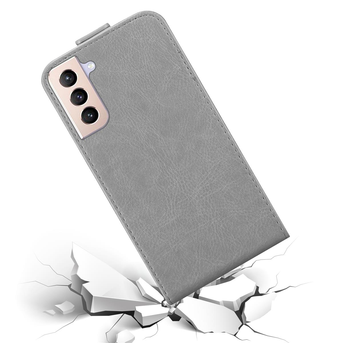Eine graue Handyhülle mit Telefon, zerbrochene Oberfläche. Das Telefon ist in der Hülle, die auf dem Boden liegt.