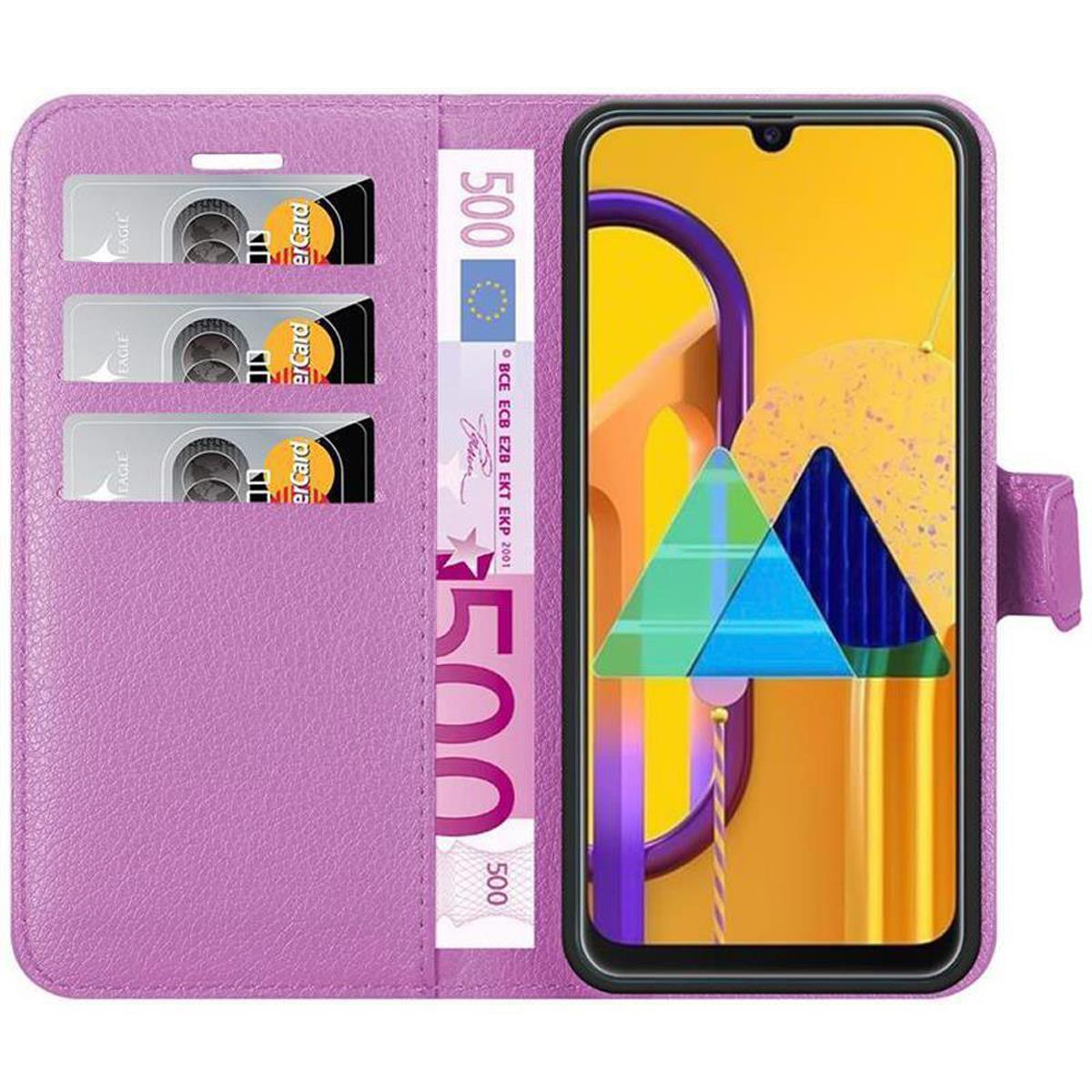 Custodia del telefono viola aperta con carte di credito e denaro all'interno. Schermo del telefono con grafica.