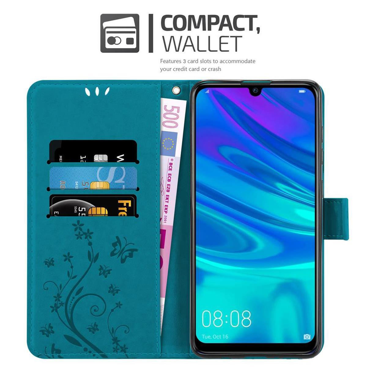 Custodia a portafoglio turchese con telefono e carte. Include banconota da 500 euro e design floreale.