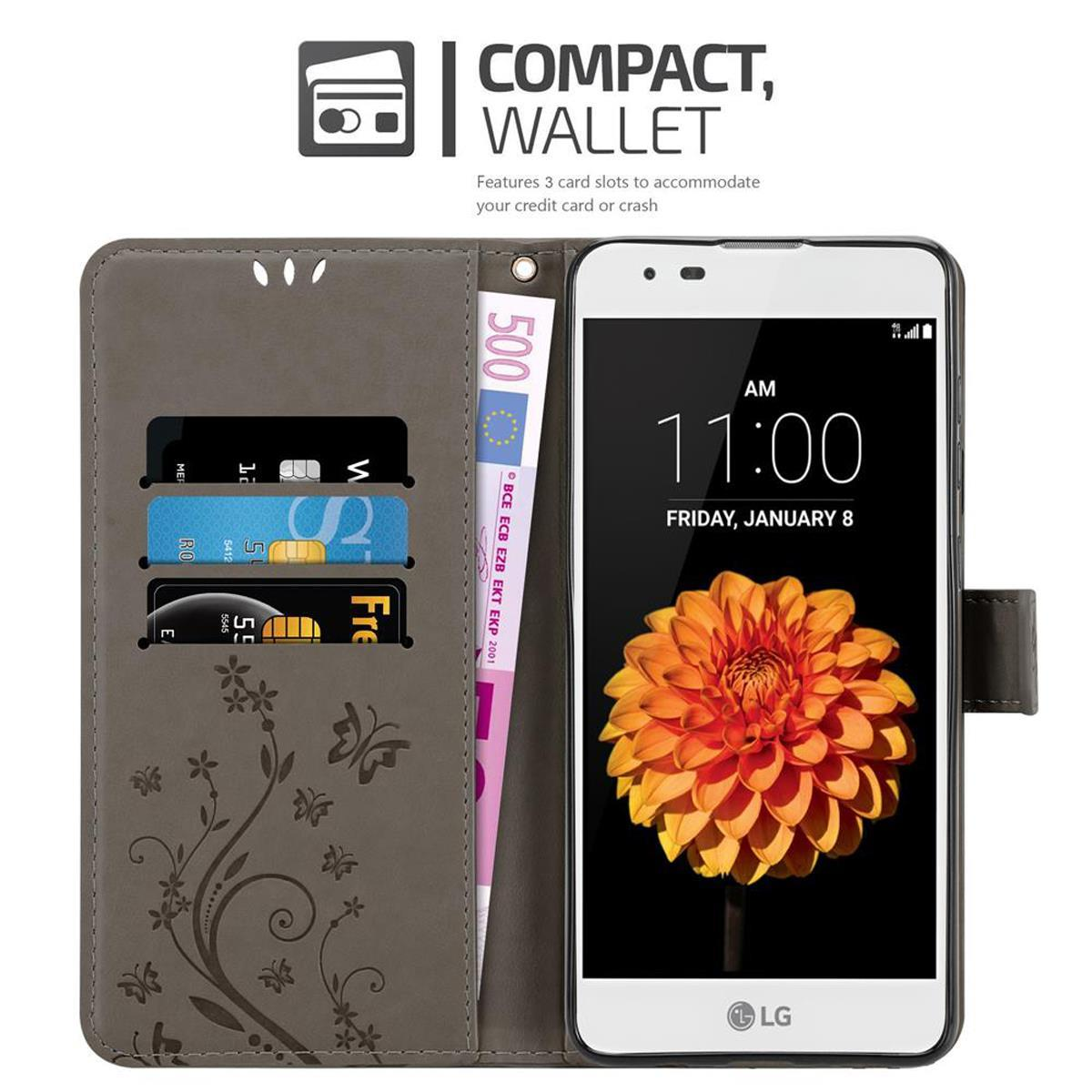 Funda de teléfono con tarjetas y dinero. El teléfono muestra una imagen de flores. Texto: COMPACTO, CARTERA.