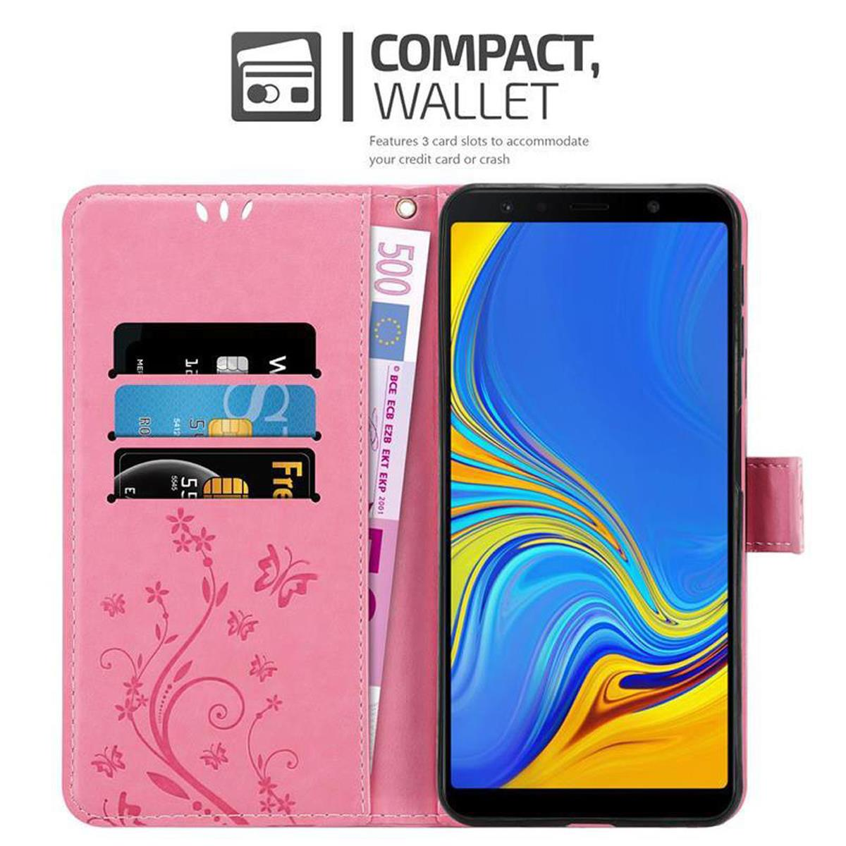 Custodia rosa per telefono con telefono e carte. Custodia rosa con design floreale e testo. Schermo blu del telefono.