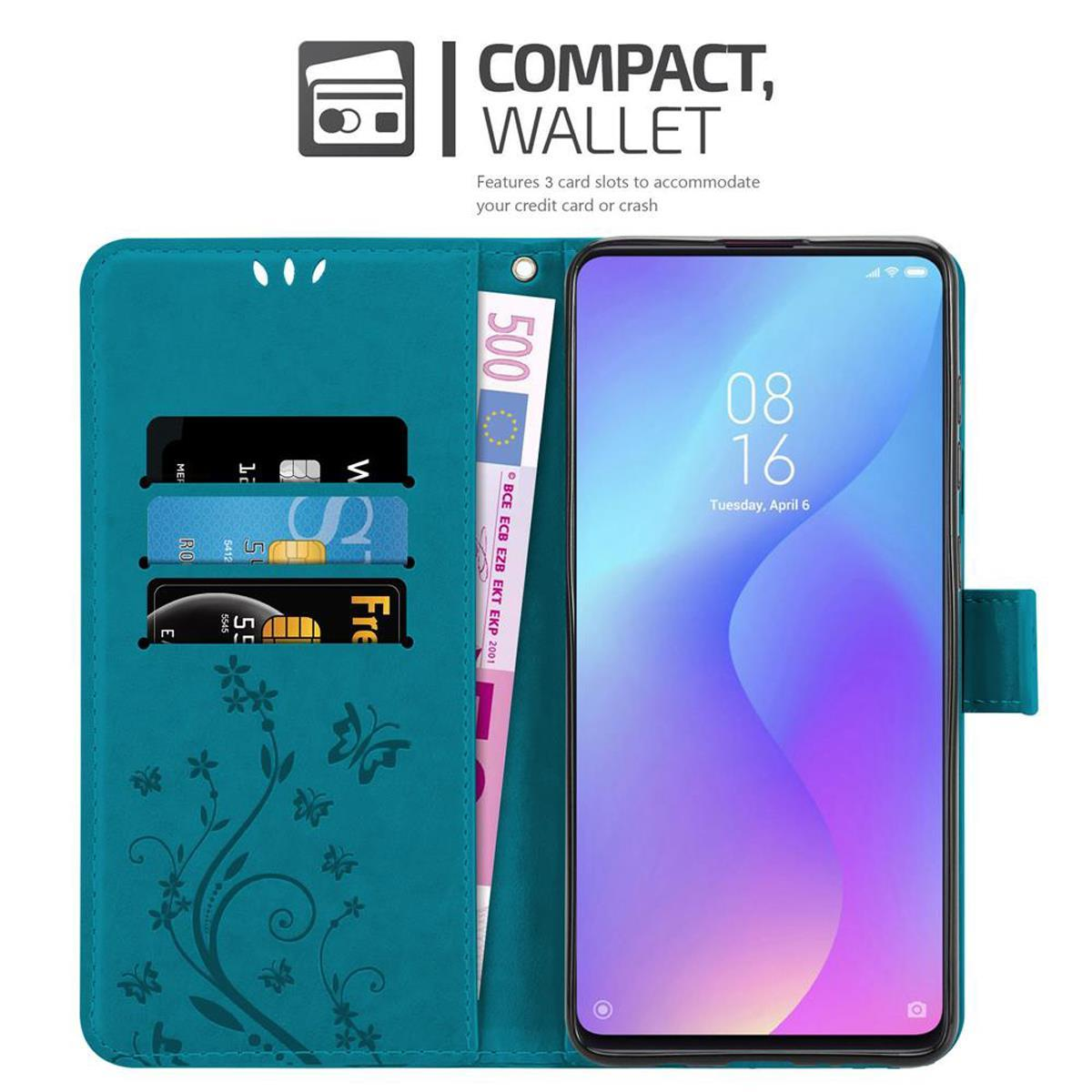 Custodia per telefono turchese con slot per carte di credito e tasca per contanti. Un telefono con schermo blu e viola.