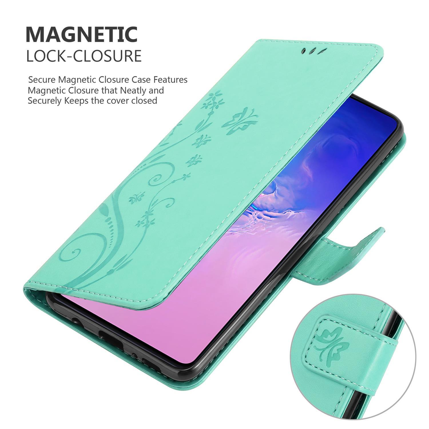 Custodia per telefono verde menta, aperta. Lo schermo è visibile. La custodia è decorata con motivi floreali.