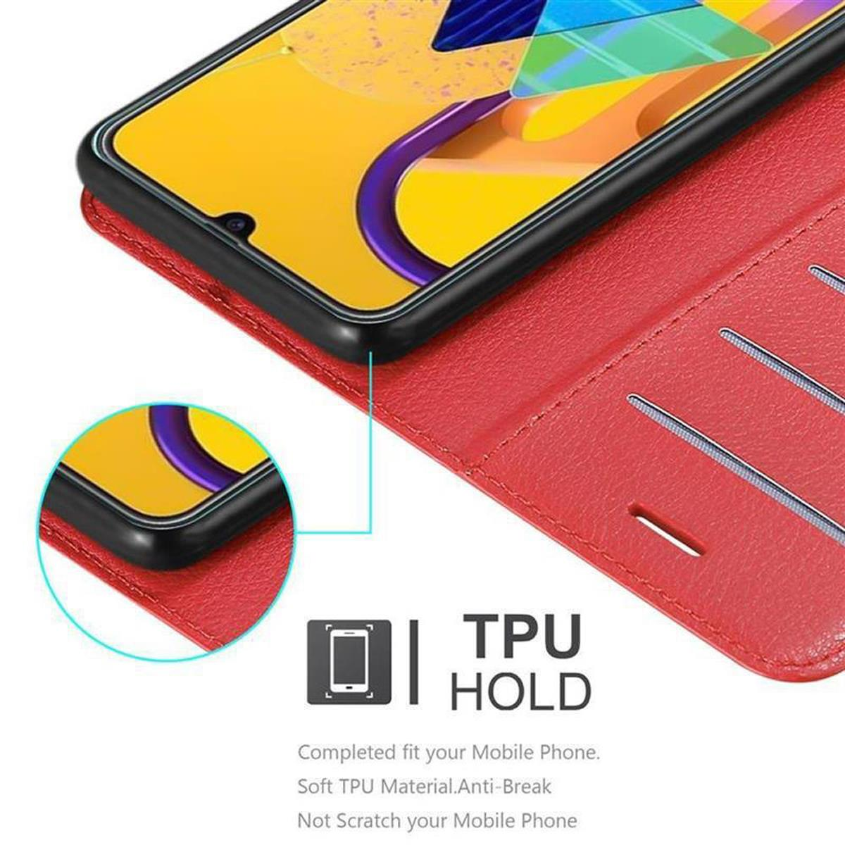 Custodia rossa con telefono, il telefono ha uno schermo giallo.