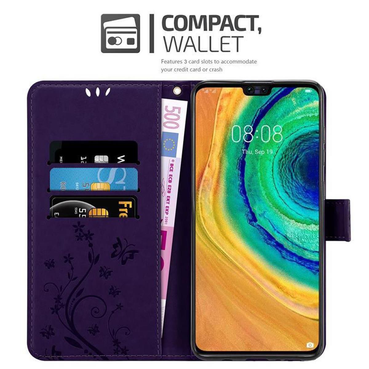 Una custodia a portafoglio viola per telefono con carte e denaro all'interno. Il telefono è sullo schermo.