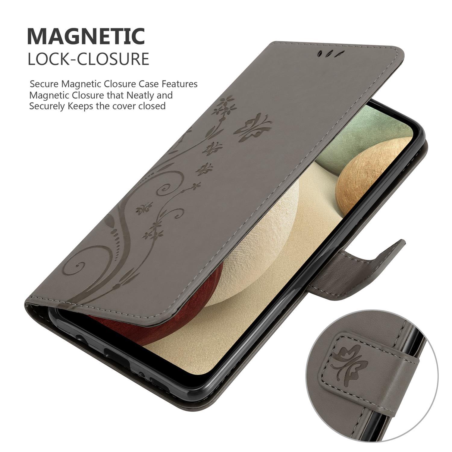 Custodia grigia per telefono aperta. La custodia ha un motivo floreale e una chiusura magnetica. Il telefono è all'interno.