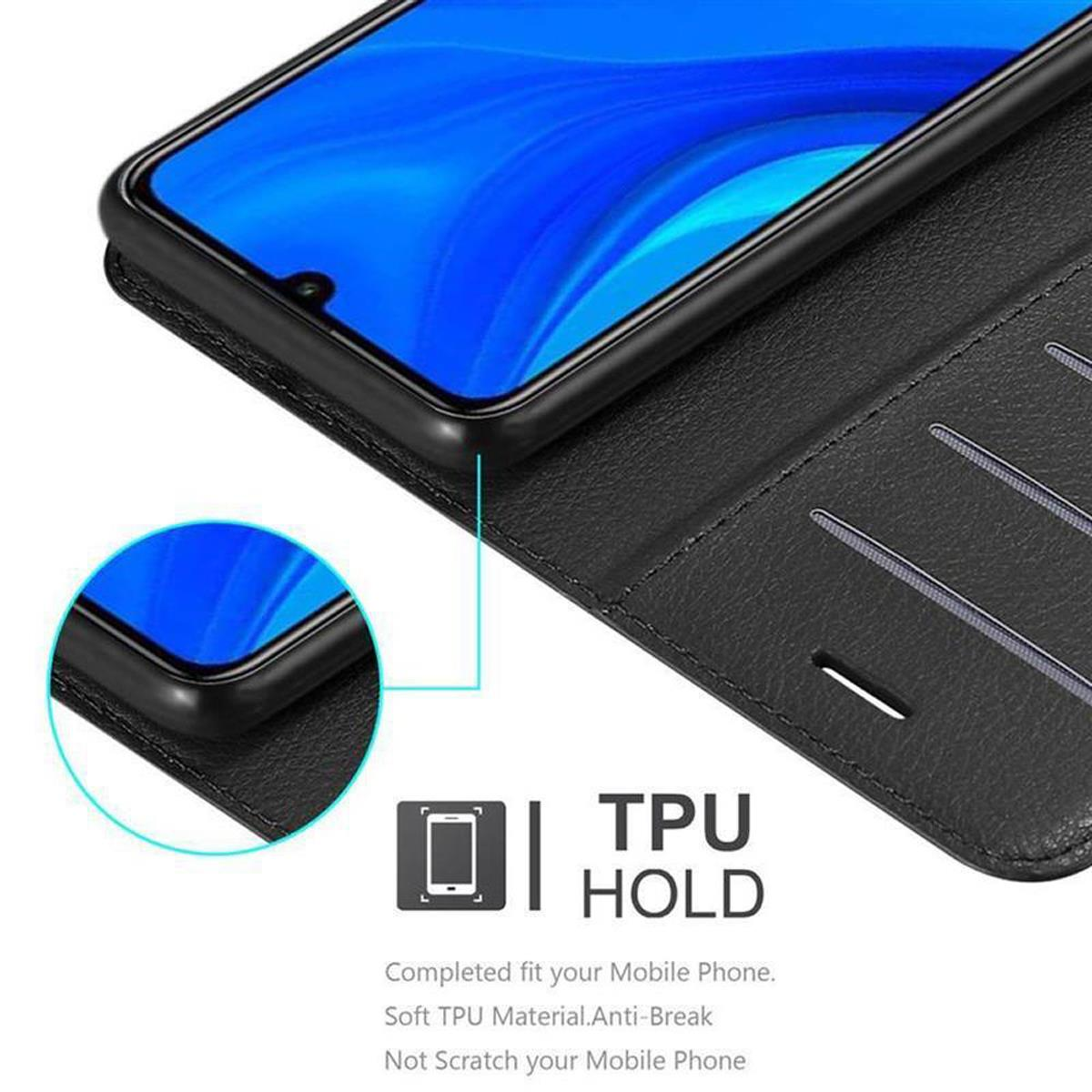 Telefono in una custodia nera. Testo: TPU HOLD. Vestibilità perfetta per il tuo telefono.