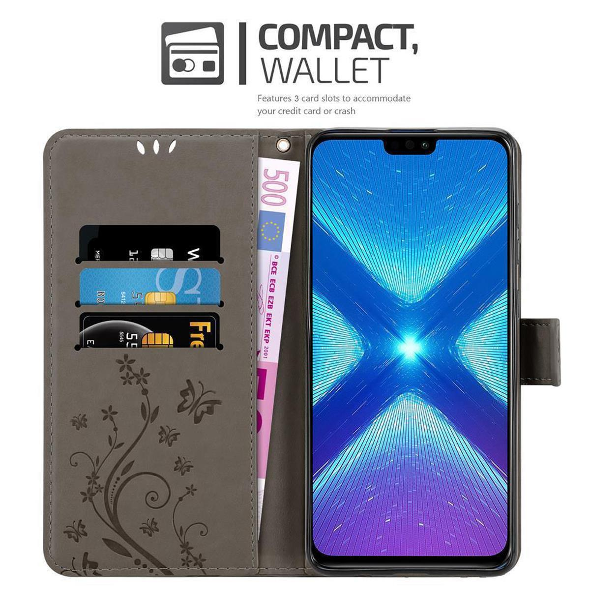 Custodia grigia per telefono aperta con carte e denaro. Il telefono mostra un display. Testo 'COMPACT, WALLET'.