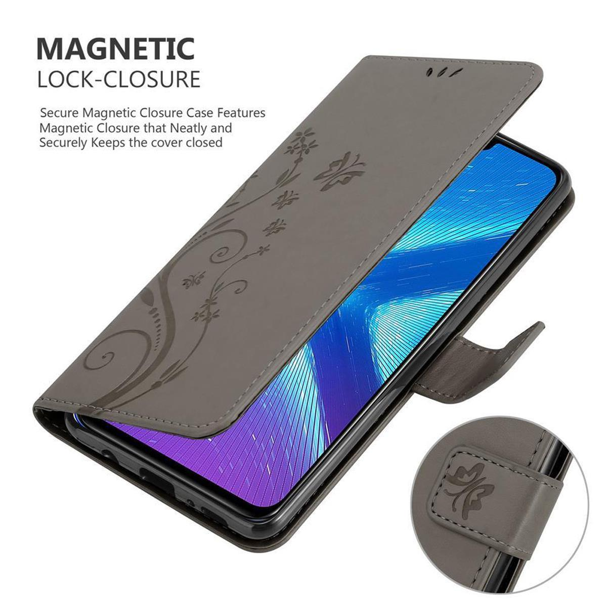 Custodia grigia aperta con telefono dentro. Motivo floreale sulla copertina.