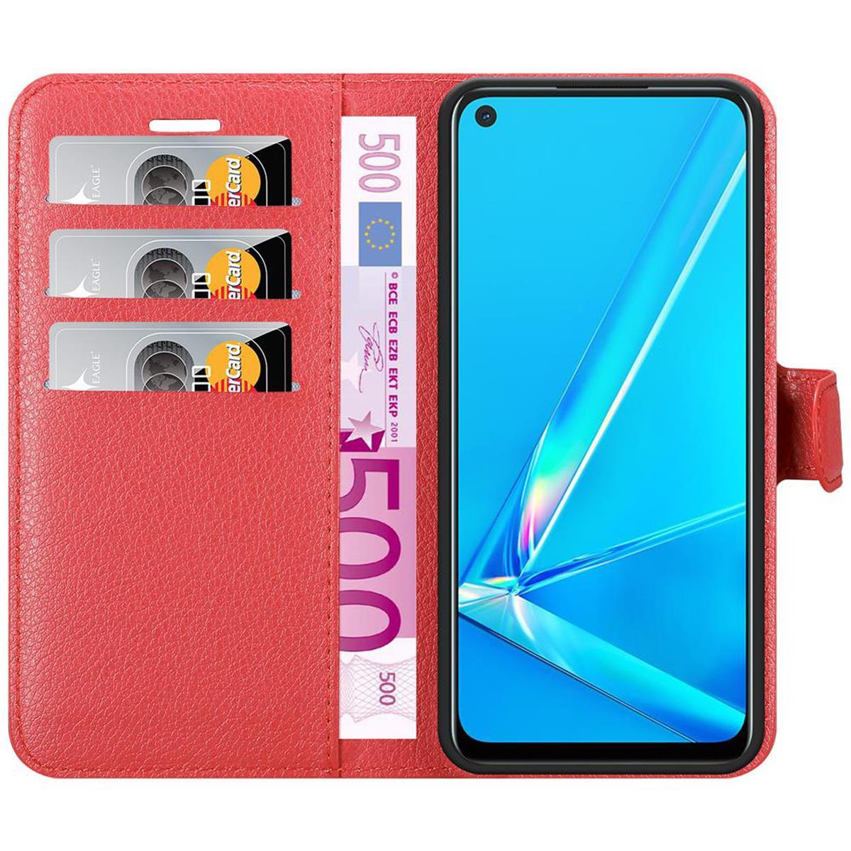 Rote Handyhülle, Karten, 500-Euro-Note, Telefon mit blauem Bildschirm.