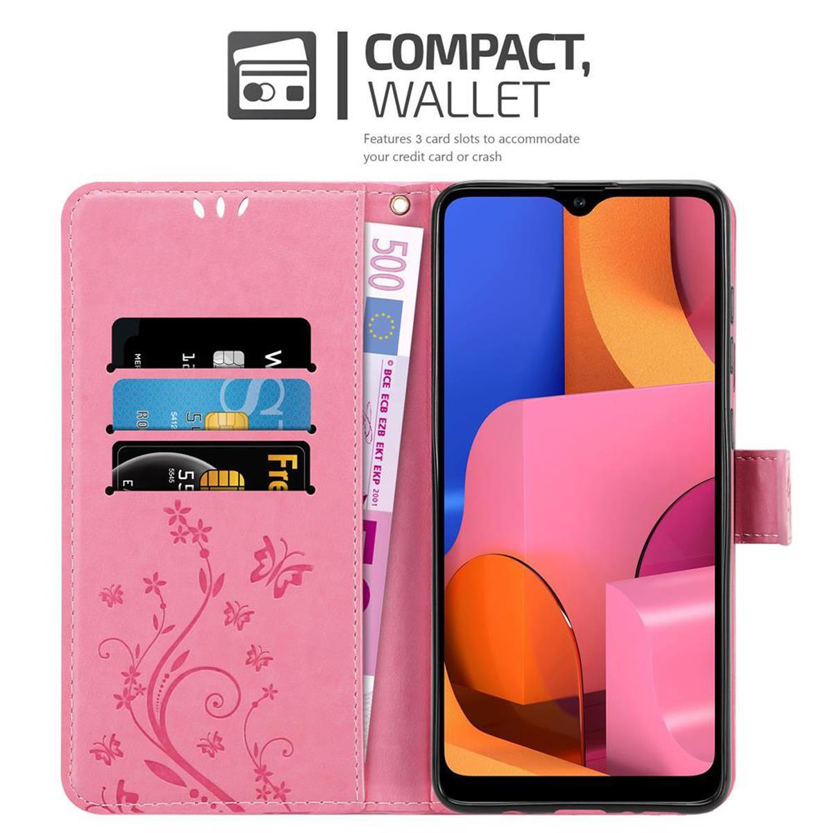 Una custodia per telefono rosa aperta, con telefono, carte e denaro.
