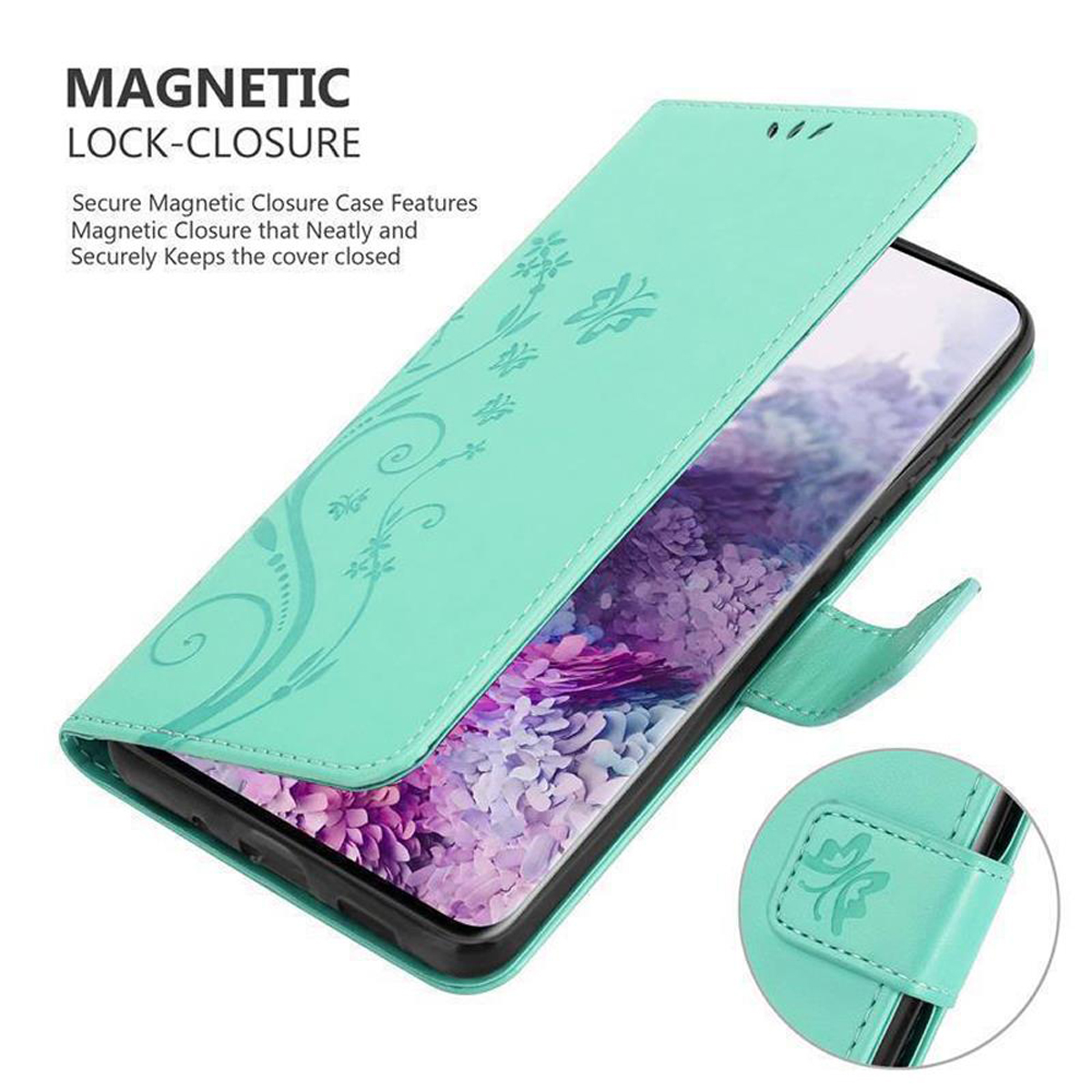 Eine türkisgrüne Handyhülle mit floralem Design, geöffnet, um das Telefon freizugeben. Magnetverschluss sichtbar.