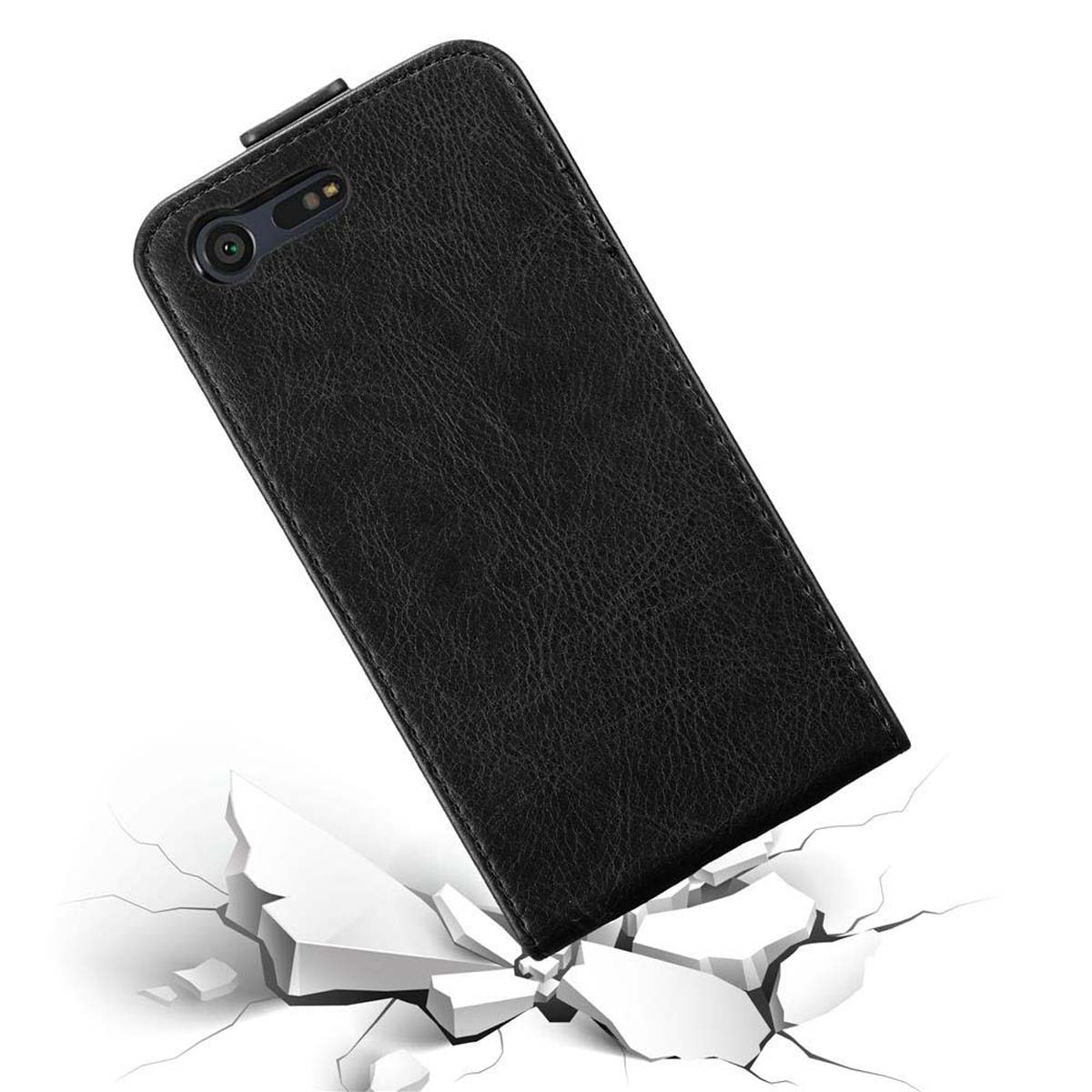 Schwarze Leder-Handyhülle fällt auf eine zerbrochene Oberfläche. Das Telefon ist in der Hülle.