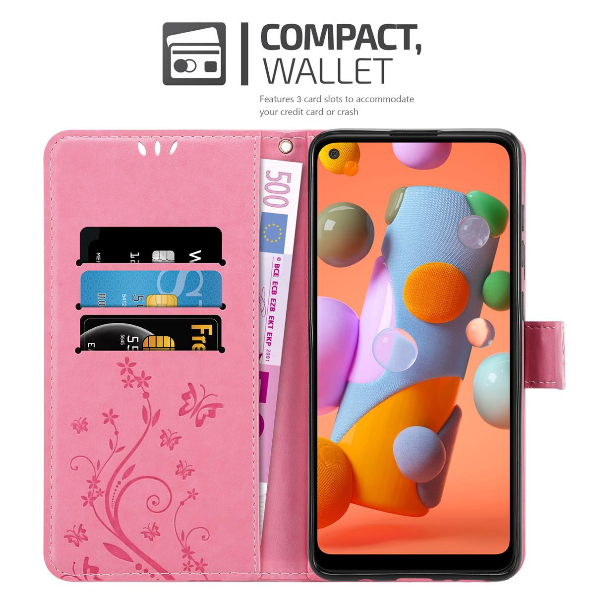 Custodia rosa con slot per carte, banconota da 500 euro e telefono con sfondo colorato.