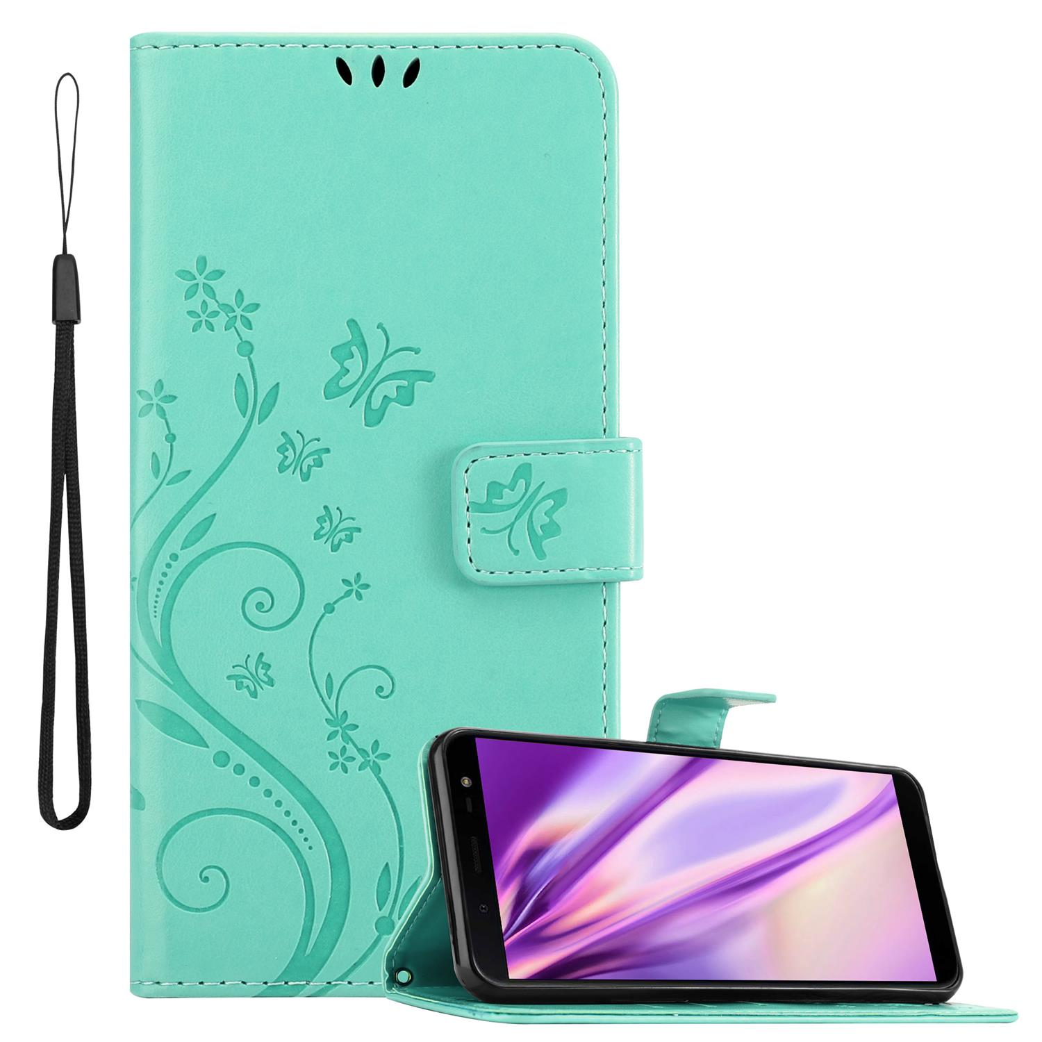 Un étui vert menthe avec un téléphone à l'intérieur et une dragonne attachée.