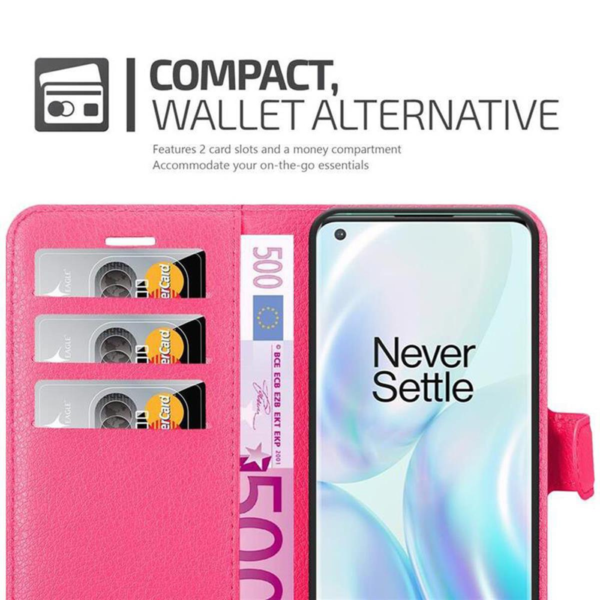 Custodia rosa, aperta. Dispone di slot per carte, un vano per soldi e un telefono.