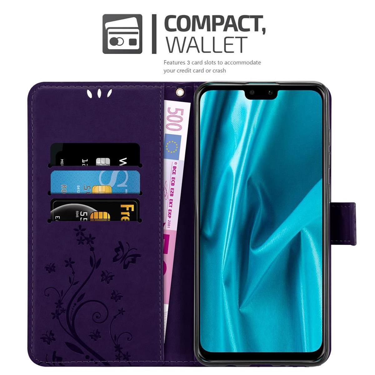 Funda morada para teléfono con tarjetas y un billete de 500 euros. El teléfono está a la derecha y hay detalles florales.
