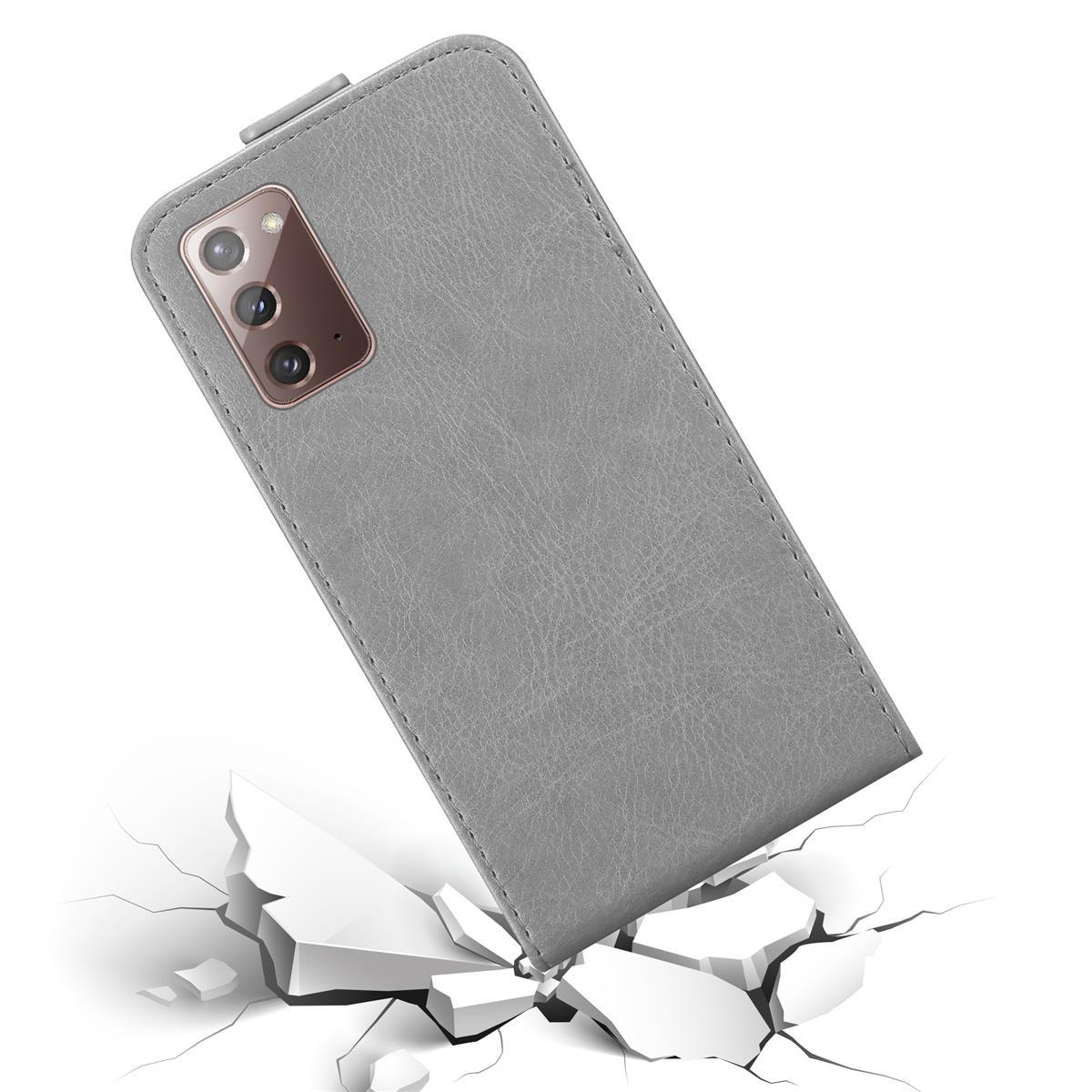 Custodia grigia per telefono su sfondo bianco, con crepe sottostanti, che mostra un telefono.