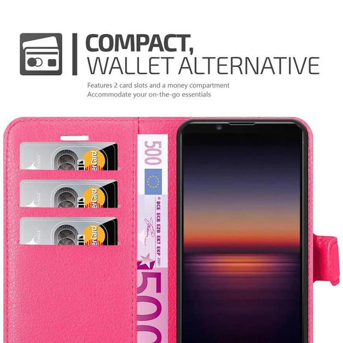 Custodia per telefono rosa aperta con telefono, carte e denaro visibili. Testo: 'Compatto, Alternativa al portafoglio'.