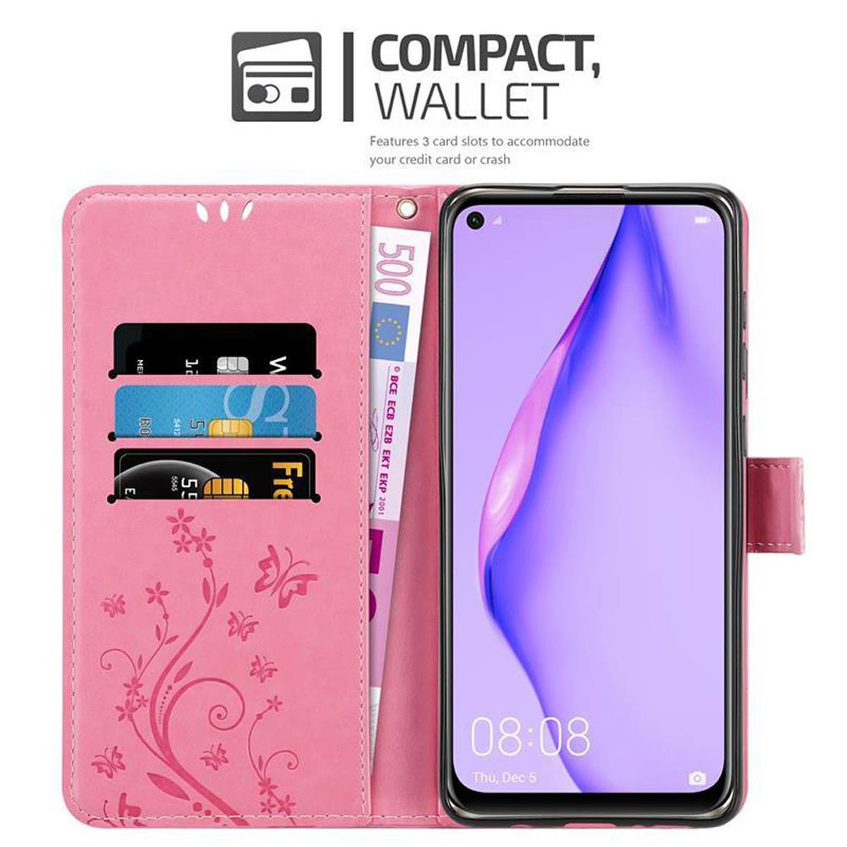 Custodia rosa per telefono, aperta con telefono, denaro e carte. Design floreale. Sfondo bianco.