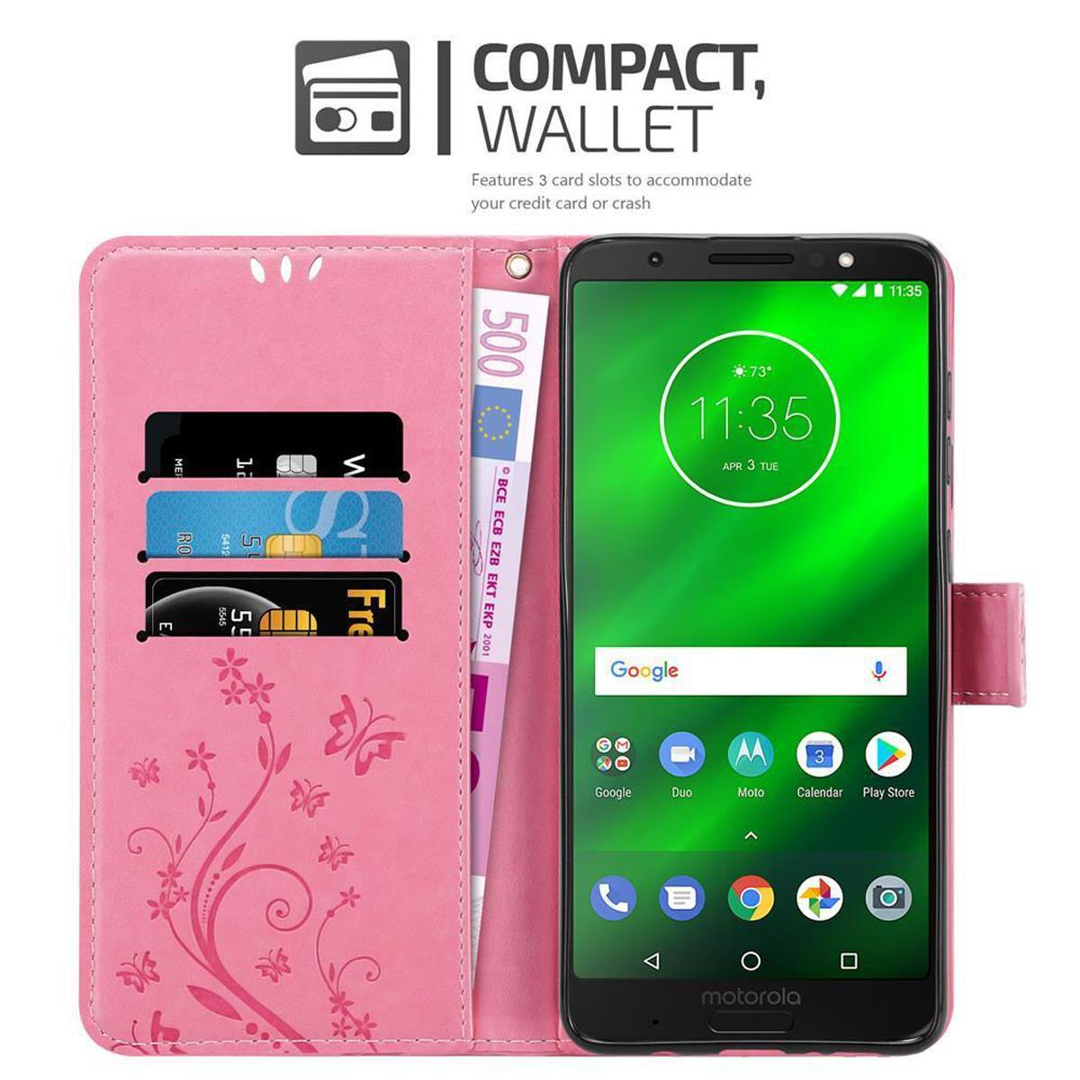 Custodia rosa per telefono aperta, con telefono dentro. Carte e banconota da 500 euro. Telefono nero.