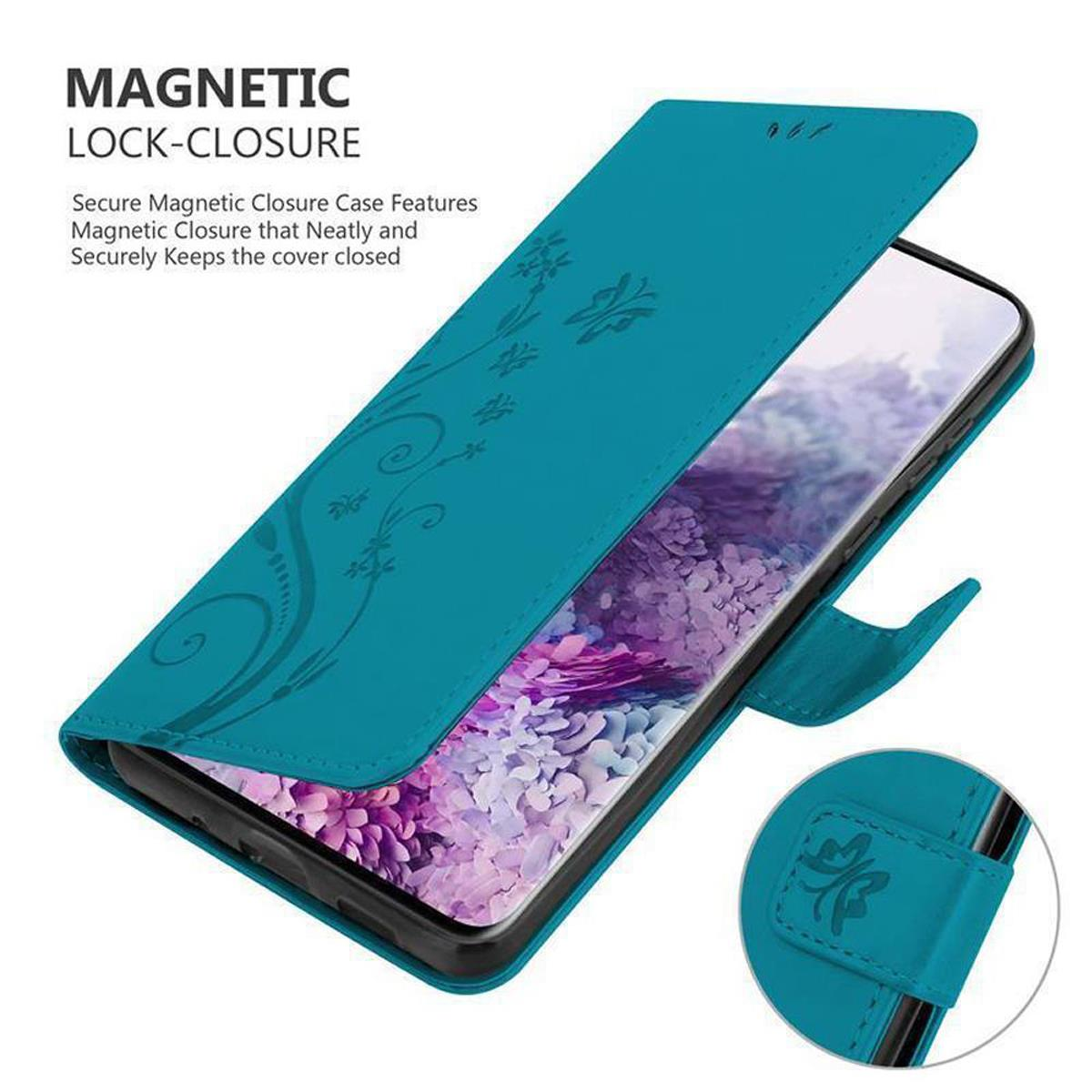 Türkisfarbene Handyhülle, offen, mit Blumendesign auf der Vorderseite. Telefon innen sichtbar, Magnetverschluss.