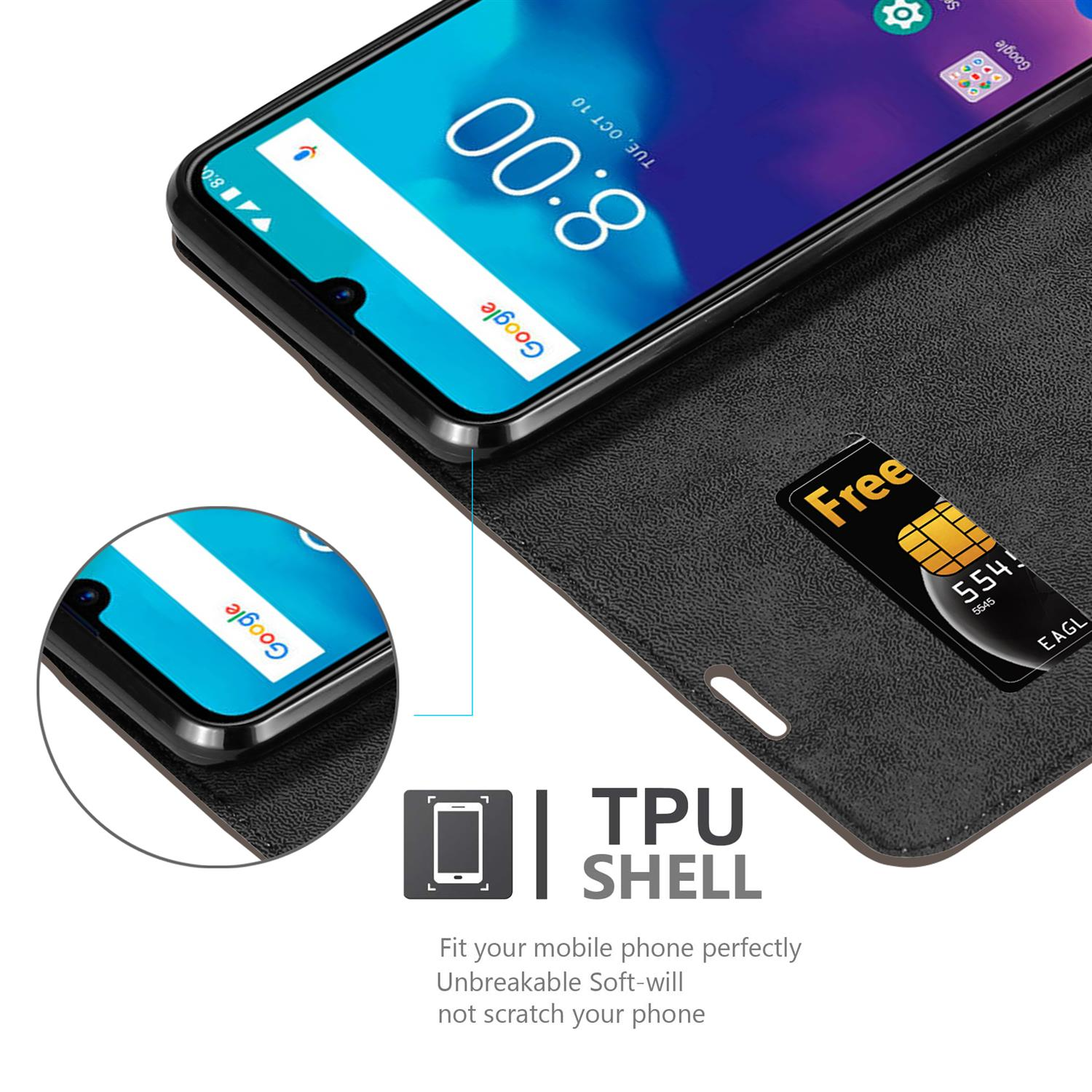 Telefono nero in una custodia nera con scheda SIM dorata. Testo: Guscio in TPU.