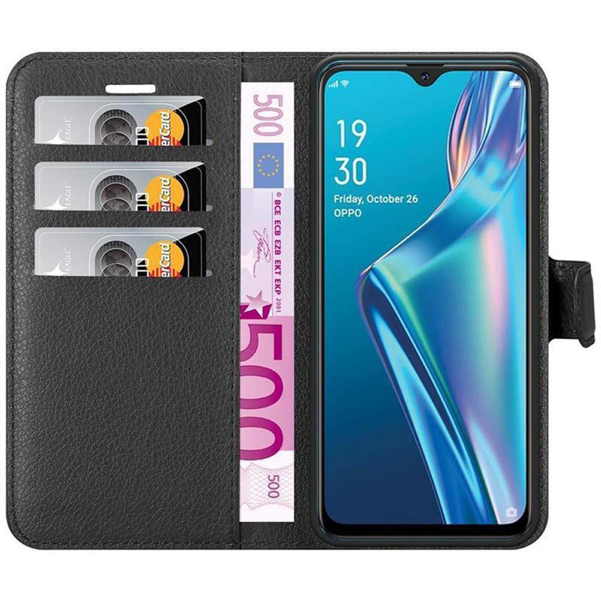 Schwarze Brieftasche mit Telefon, Karten und einem 500-Euro-Schein.