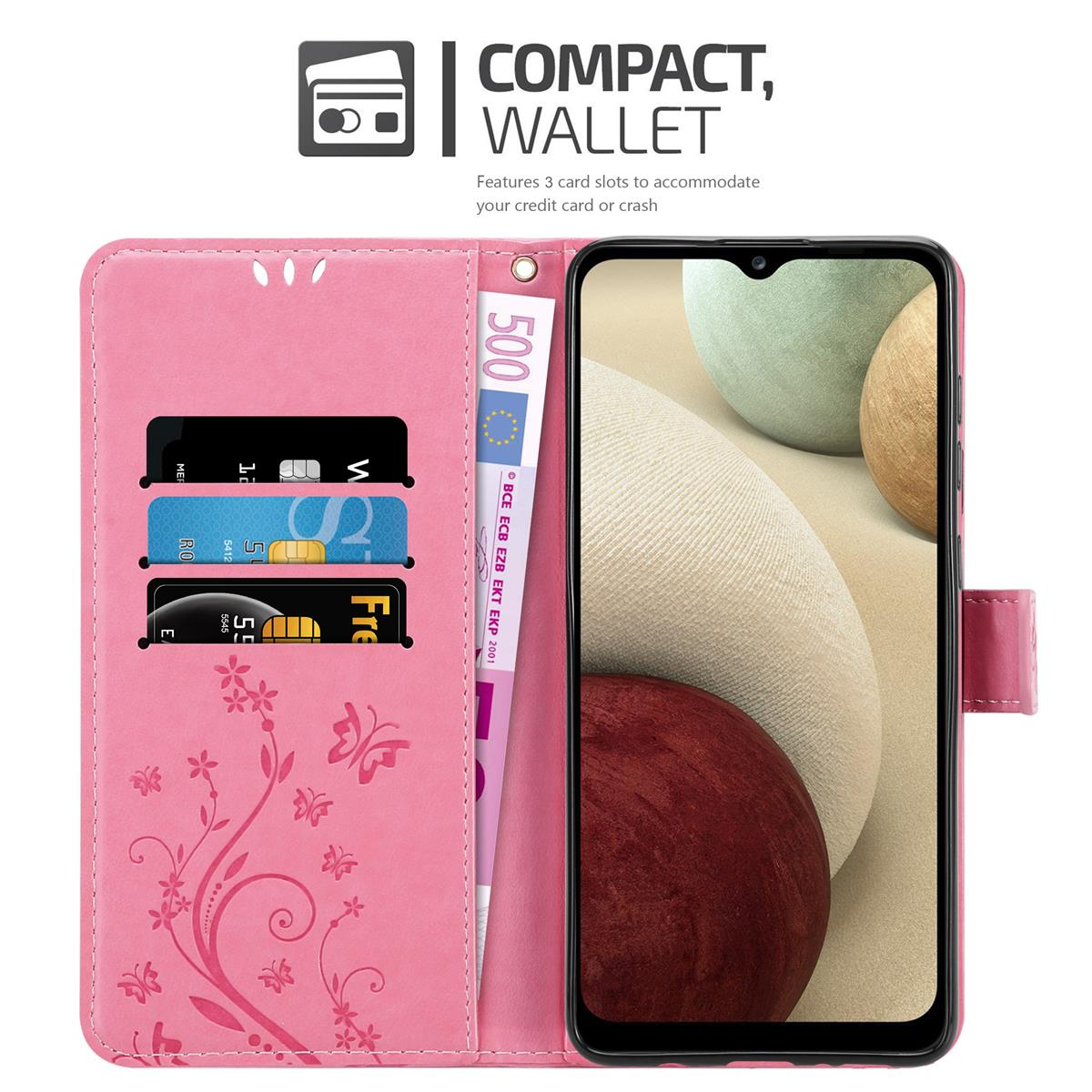 Custodia a portafoglio rosa con telefono, carte e denaro all'interno. Testo: 'WALLET'.