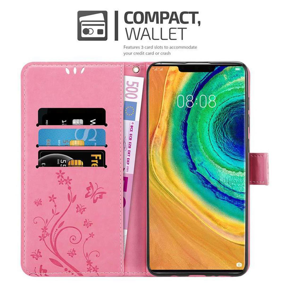 Custodia a portafoglio rosa con telefono, carte di credito e banconota da 500 euro. Il telefono mostra uno sfondo colorato.