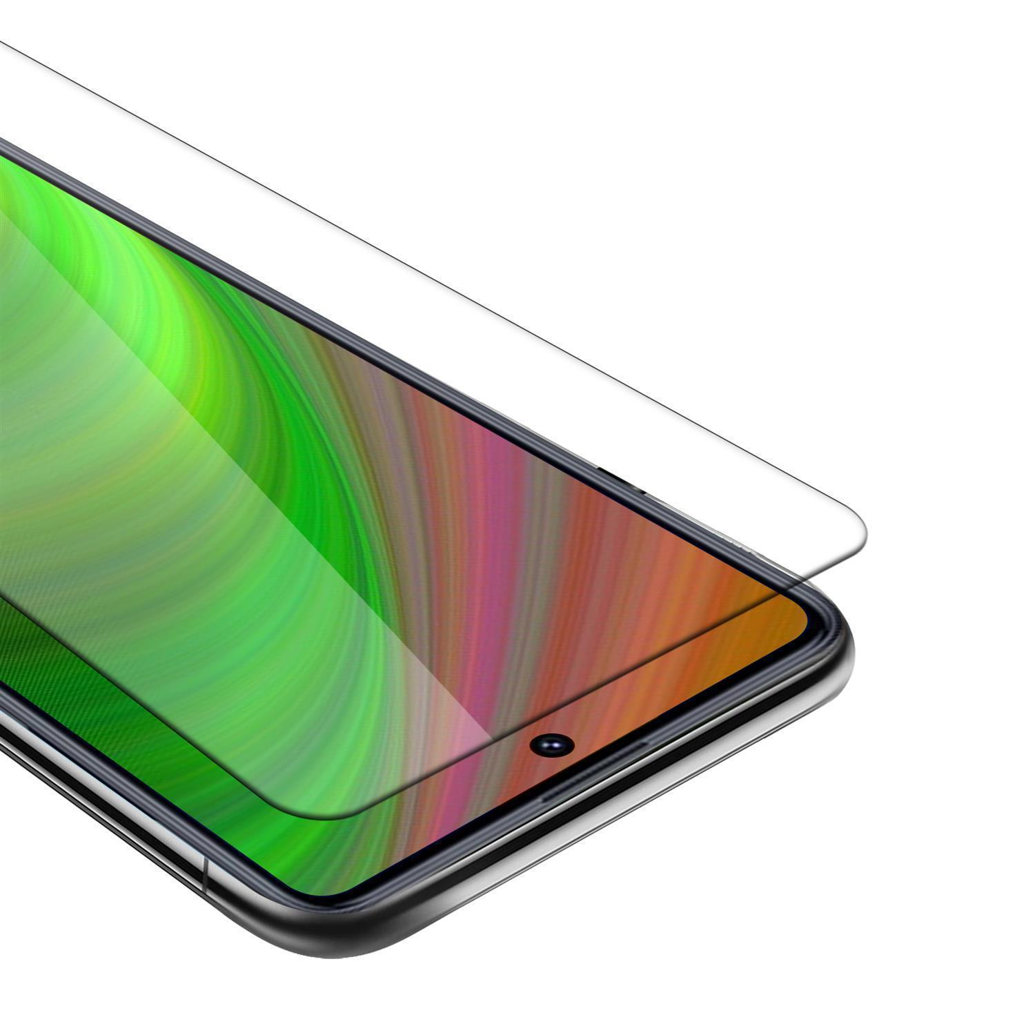 Un proteggi schermo per cellulare viene applicato. Lo schermo mostra un design colorato.