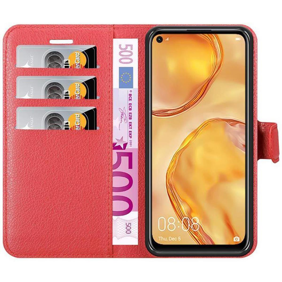 Custodia rossa aperta, con fessure per carte e denaro. Telefono che mostra l'ora.