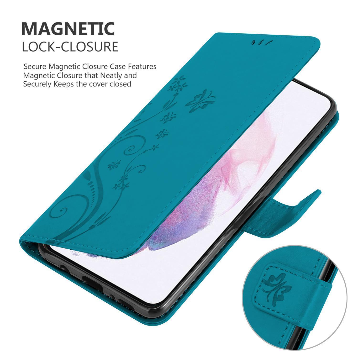 Custodia per telefono turchese con design floreale. Il telefono è all'interno. Chiusura magnetica visibile.