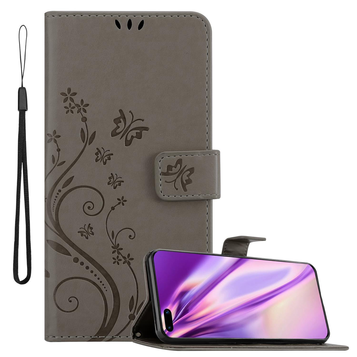 Custodia grigia con design floreale. Il telefono è aperto, mostrando uno schermo viola.