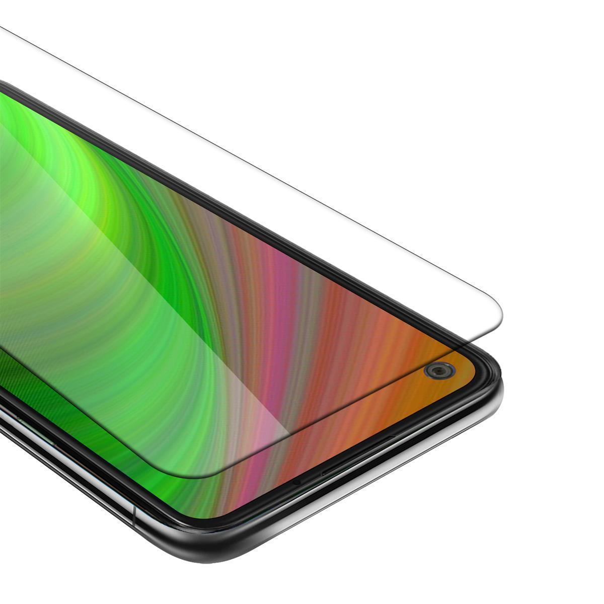 Una protezione per lo schermo viene applicata a un telefono. Lo schermo è colorato.